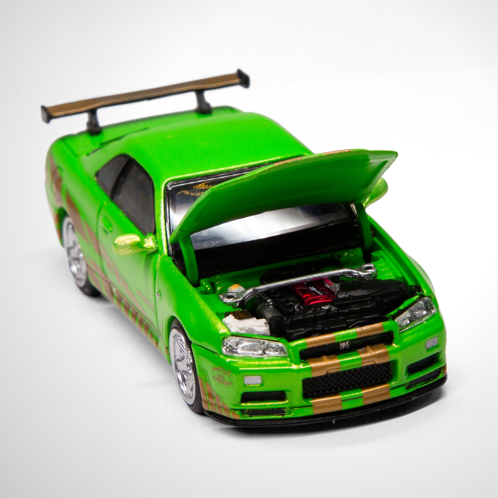 Miniatura Motorhelix Nissan Skyline GT-R (R34) V-Spec II Customized Green, código M63465DZ-BR